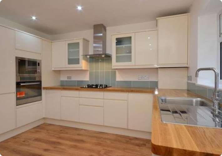 White shaker kitchen with oak worktops